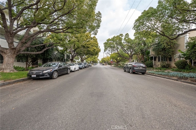 view of street with curbs