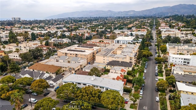 drone / aerial view featuring a mountain view