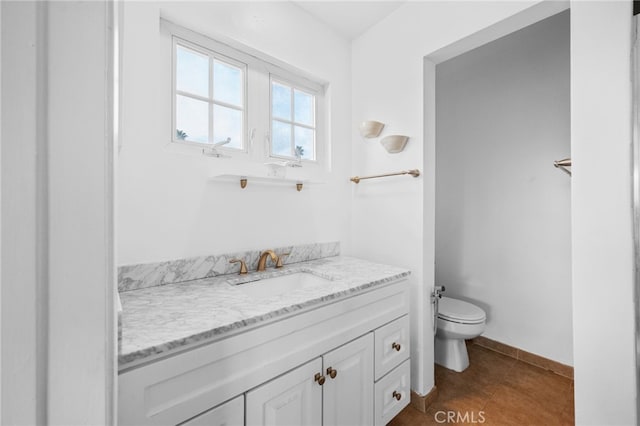 bathroom featuring tile patterned floors, toilet, and vanity