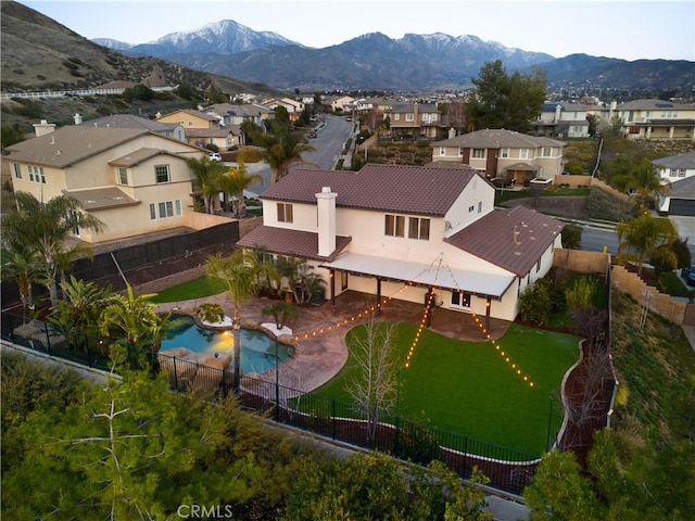 birds eye view of property with a residential view and a mountain view