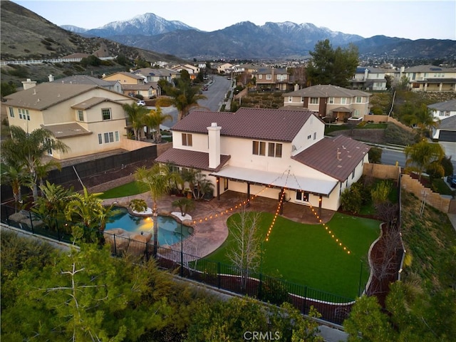 birds eye view of property with a residential view and a mountain view
