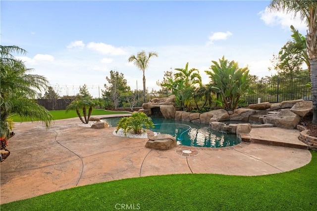 view of pool featuring a fenced in pool, a lawn, fence, and a patio