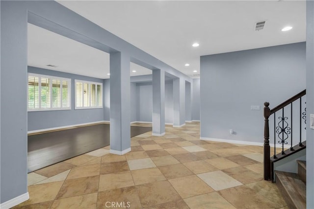 interior space featuring recessed lighting, baseboards, stairs, and visible vents