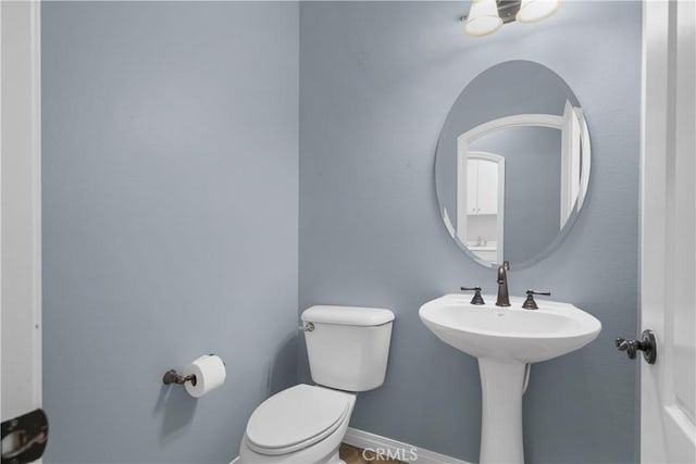 33740 Old Trail Dr, Yucaipa, CA 92399 - half bathroom featuring toilet and baseboards