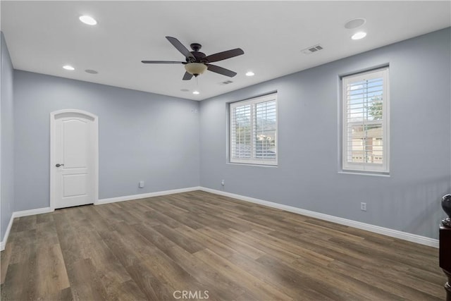 unfurnished room featuring visible vents, a ceiling fan, wood finished floors, recessed lighting, and baseboards