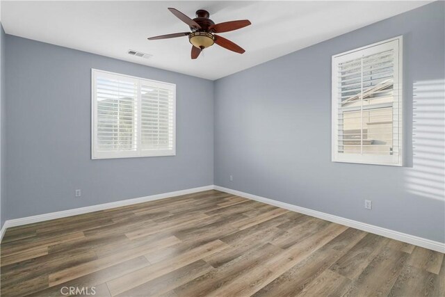 33740 Old Trail Dr, Yucaipa, CA 92399 - empty room featuring wood finished floors, ceiling fan, and baseboards