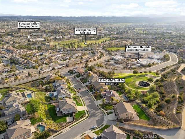 birds eye view of property with a residential view