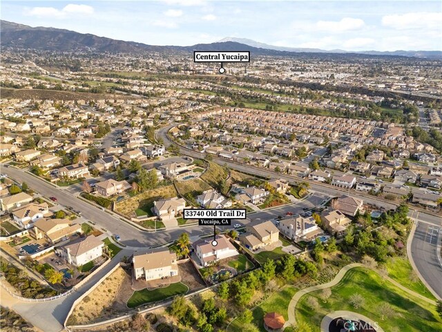 33740 Old Trail Dr, Yucaipa, CA 92399 - aerial view of property's location featuring nearby suburban area and a mountain backdrop
