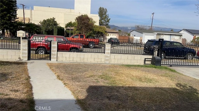 view of yard with fence and a gate