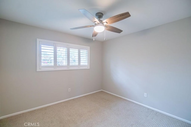 unfurnished room with ceiling fan, baseboards, and carpet floors