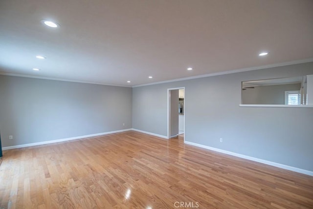 unfurnished room with recessed lighting, light wood-style floors, baseboards, and ornamental molding