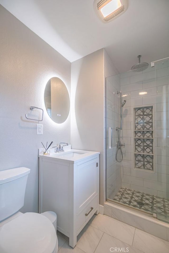 full bath with visible vents, vanity, toilet, and a shower stall