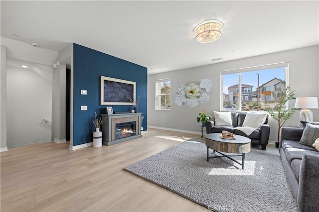 27046 Tanager Ln, Valencia, CA 91381 - living room with wood finished floors and a glass covered fireplace