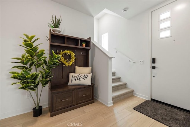 27046 Tanager Ln, Valencia, CA 91381 - entrance foyer with light wood-style floors and stairs