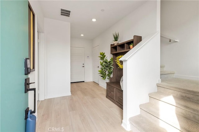 27046 Tanager Ln, Valencia, CA 91381 - foyer entrance featuring stairs, light wood-style flooring, and recessed lighting