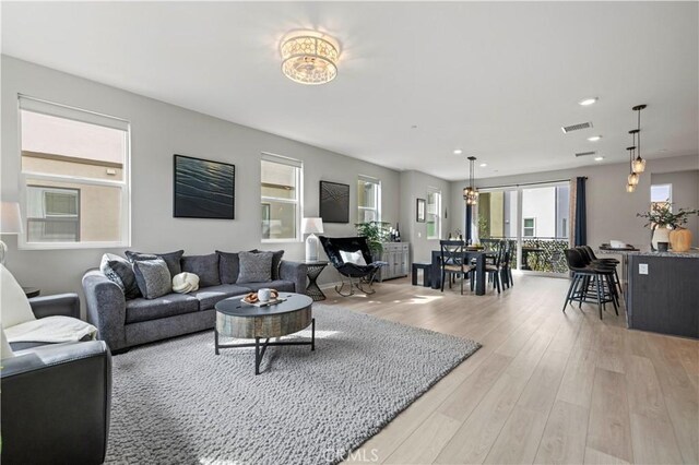 27046 Tanager Ln, Valencia, CA 91381 - living area with recessed lighting and light wood-style flooring