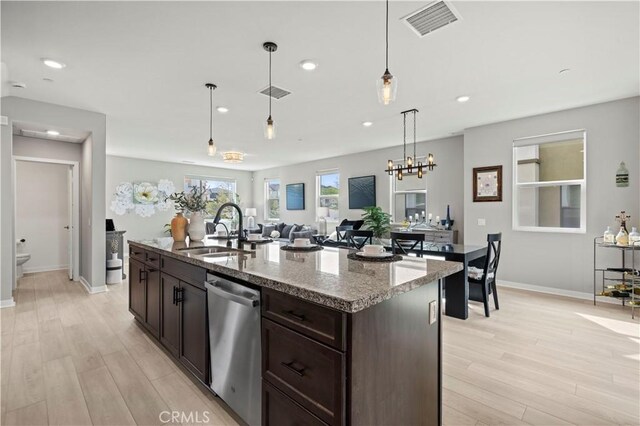 27046 Tanager Ln, Valencia, CA 91381 - kitchen featuring stainless steel dishwasher, light wood-type flooring, dark brown cabinetry, recessed lighting, and light stone countertops