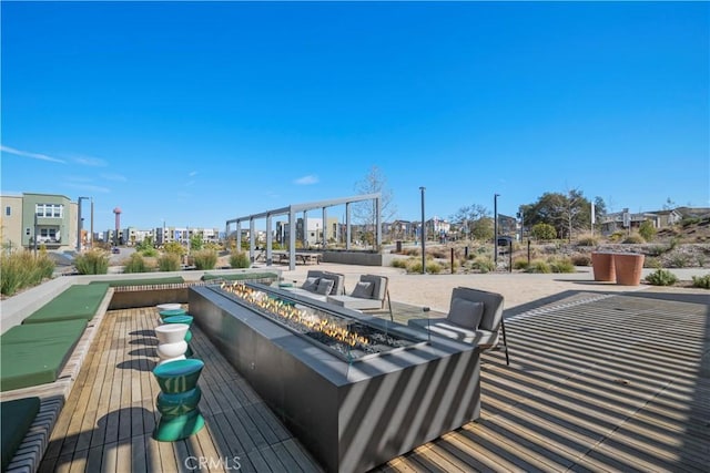 deck featuring an outdoor fire pit