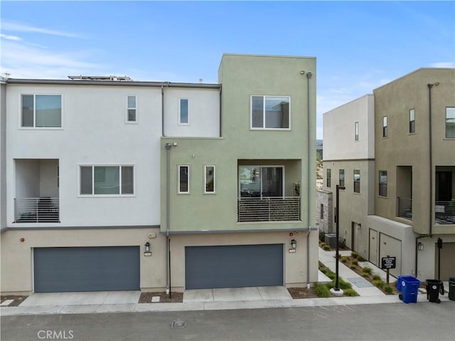 view of front of property featuring a garage and stucco siding