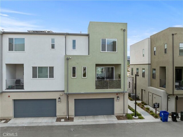 27046 Tanager Ln, Valencia, CA 91381 - view of front of property with a garage and stucco siding