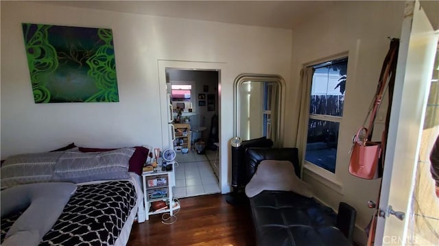 bedroom with wood finished floors