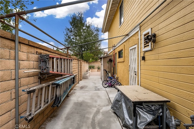 view of patio / terrace with a gate and fence