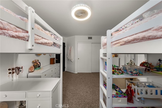 bedroom featuring visible vents, carpet floors, and a closet