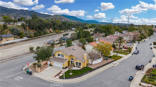 birds eye view of property with a residential view and a mountain view