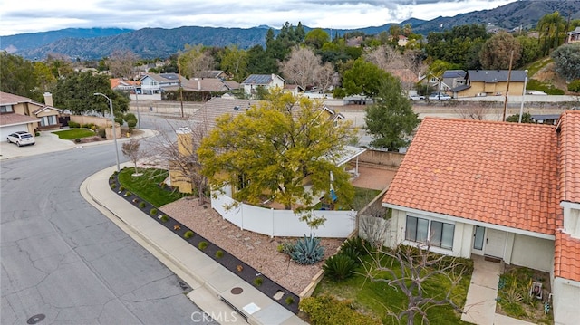 drone / aerial view with a mountain view and a residential view