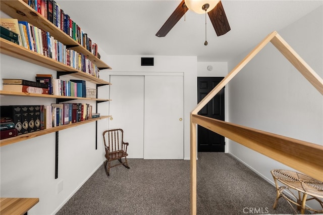 unfurnished room featuring visible vents, a ceiling fan, and carpet