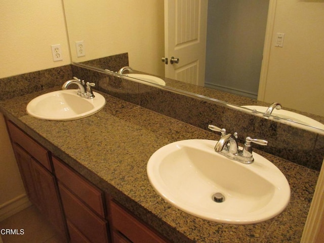 full bath featuring a sink and double vanity