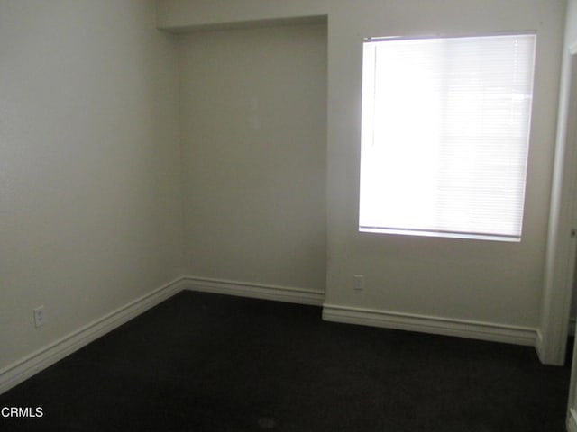 empty room with baseboards