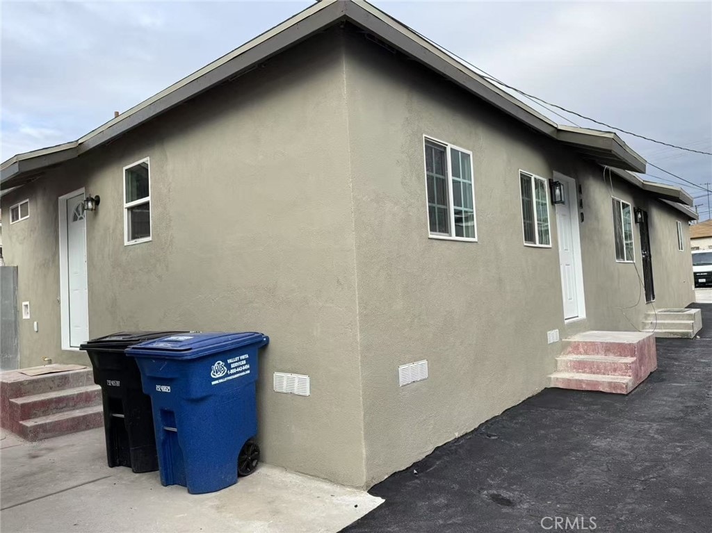 view of home's exterior featuring crawl space and stucco siding