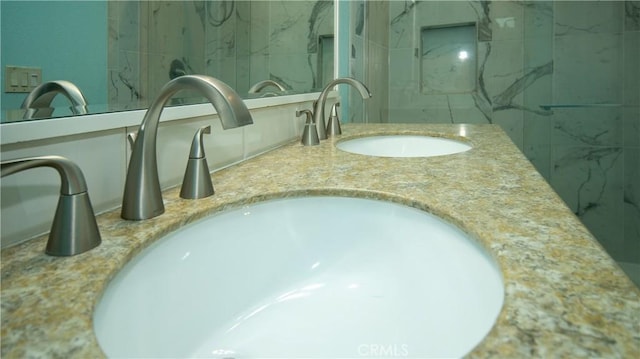 interior details featuring double vanity and a sink