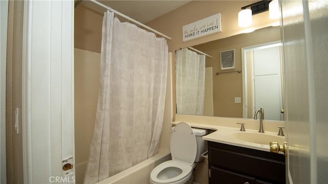 bathroom featuring vanity, shower / bath combination with curtain, and toilet