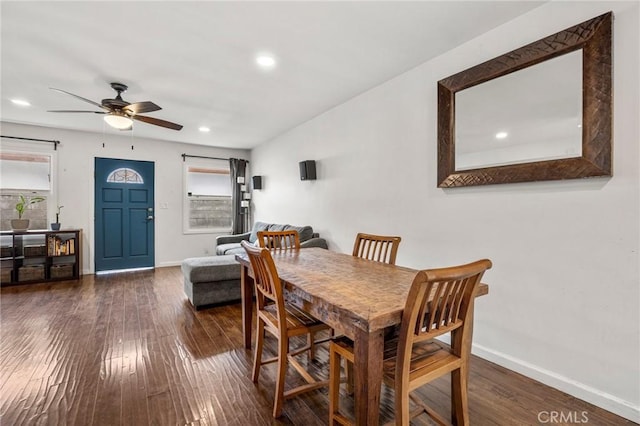 dining space featuring ceiling fan, baseboards, and wood finished floors