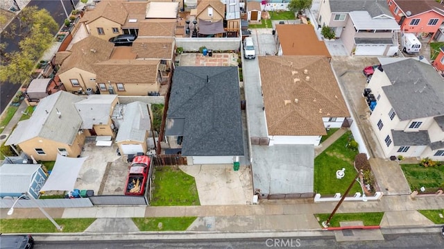 birds eye view of property with a residential view