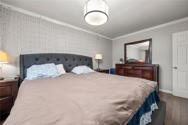 bedroom featuring crown molding, baseboards, and dark wood-type flooring