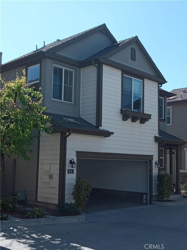 view of front of house with a garage and driveway