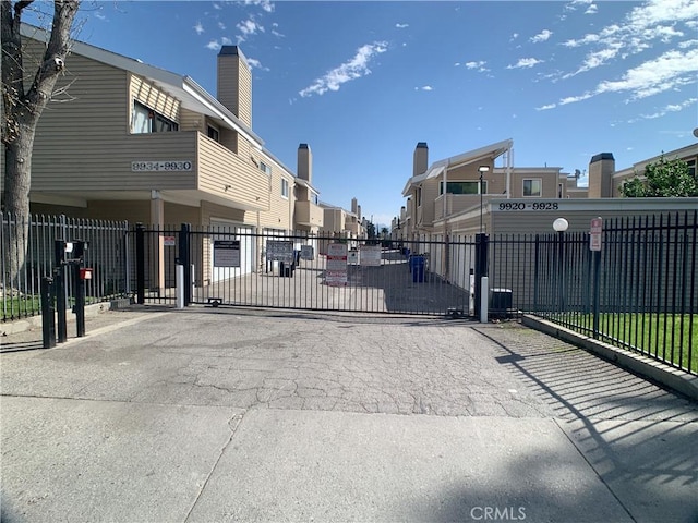 view of gate with fence