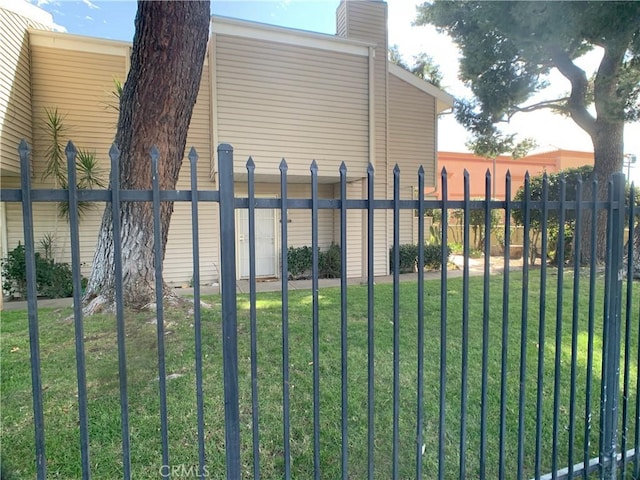 exterior space with a yard and fence