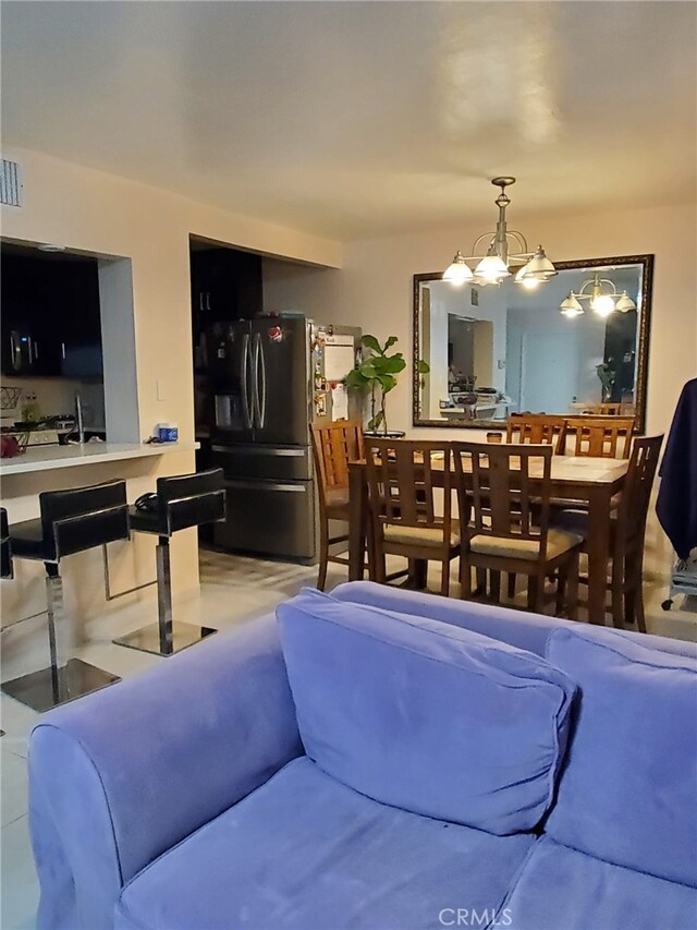 living area with a notable chandelier