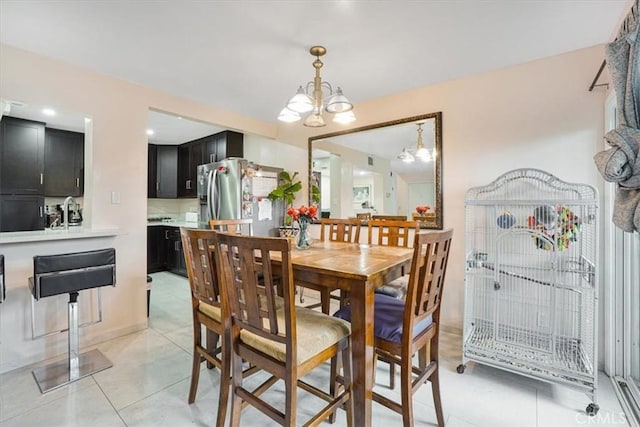 9920 Sepulveda Blvd Unit 1, Mission Hills San Fernando, CA 91345 - dining area featuring light tile patterned floors and a chandelier