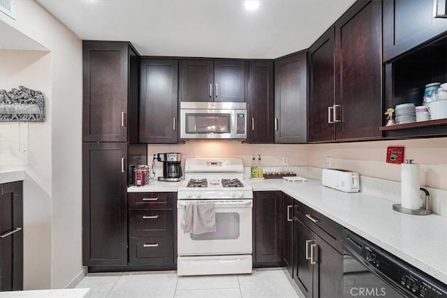 9920 Sepulveda Blvd Unit 1, Mission Hills San Fernando, CA 91345 - kitchen with stainless steel microwave, white range with gas stovetop, black dishwasher, and light tile patterned floors