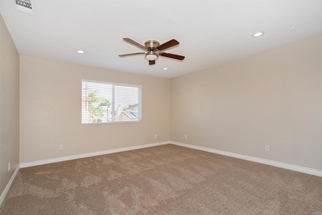 spare room featuring visible vents, baseboards, carpet flooring, recessed lighting, and a ceiling fan