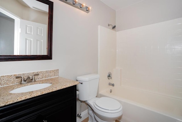 bathroom with vanity, bathing tub / shower combination, and toilet