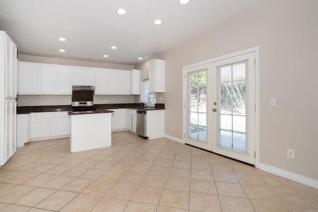 kitchen featuring a center island, recessed lighting, stainless steel appliances, french doors, and light tile patterned floors