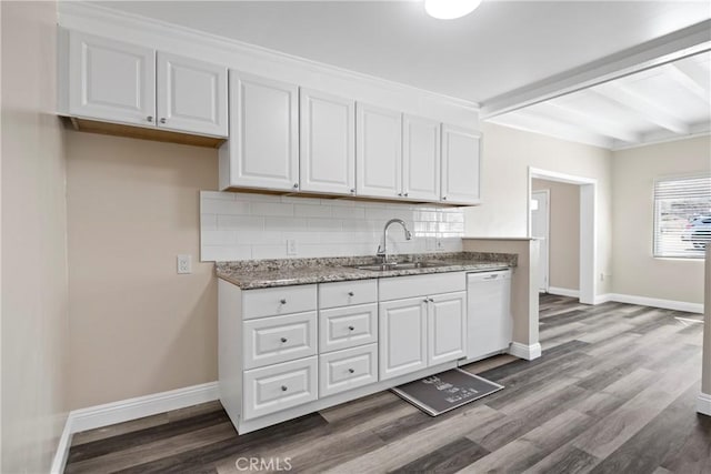 kitchen with white cabinetry, tasteful backsplash, white dishwasher, and a sink