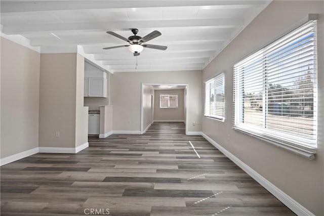 unfurnished living room featuring a ceiling fan, beamed ceiling, wood finished floors, and baseboards