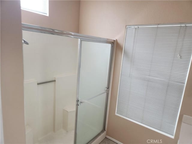 bathroom featuring an enclosed shower